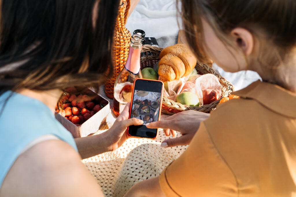 Social Media Content Ideas, Content Creator For Brands, Food Blog, Summer Picnic. Young Woman Food Blogger, Content Creator With Professional Camera Taking Food Photo Of Croissant In Picnic On Nature